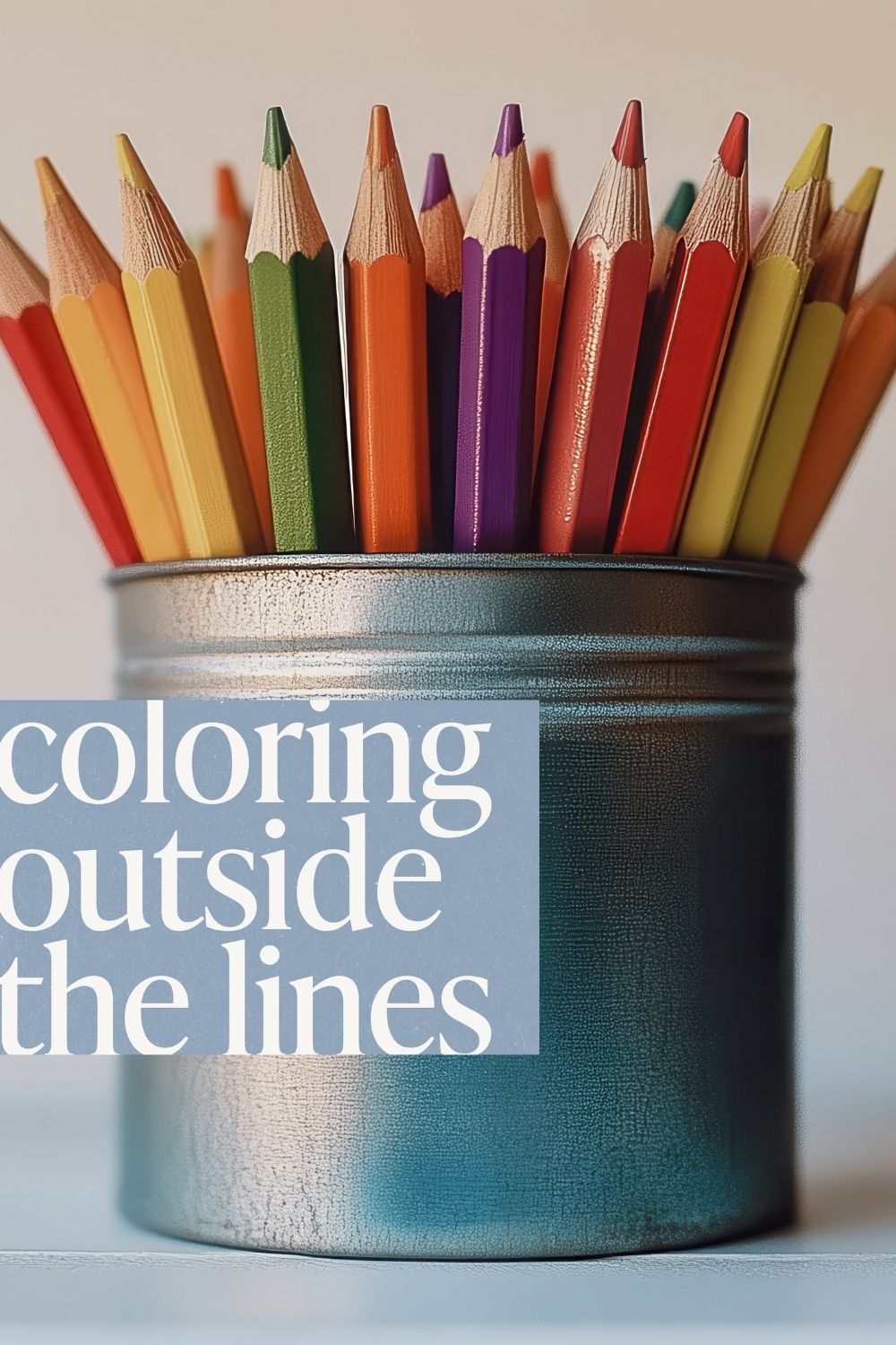 Close-up of colorful pencils in a container with the phrase coloring outside the lines, symbolizing creativity, playful hobbies, artistic freedom, and self-expression.