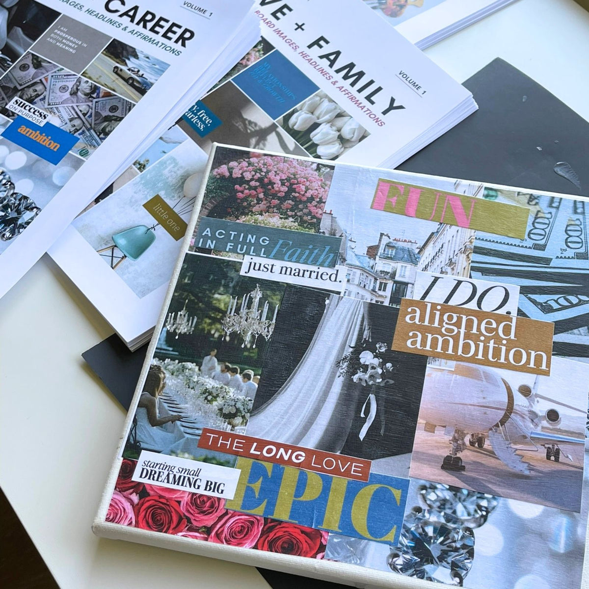 Perdie Pagoda printed vision board kits for Money and Career and Love and Family displayed with a completed vision board featuring curated images, words and affirmations.