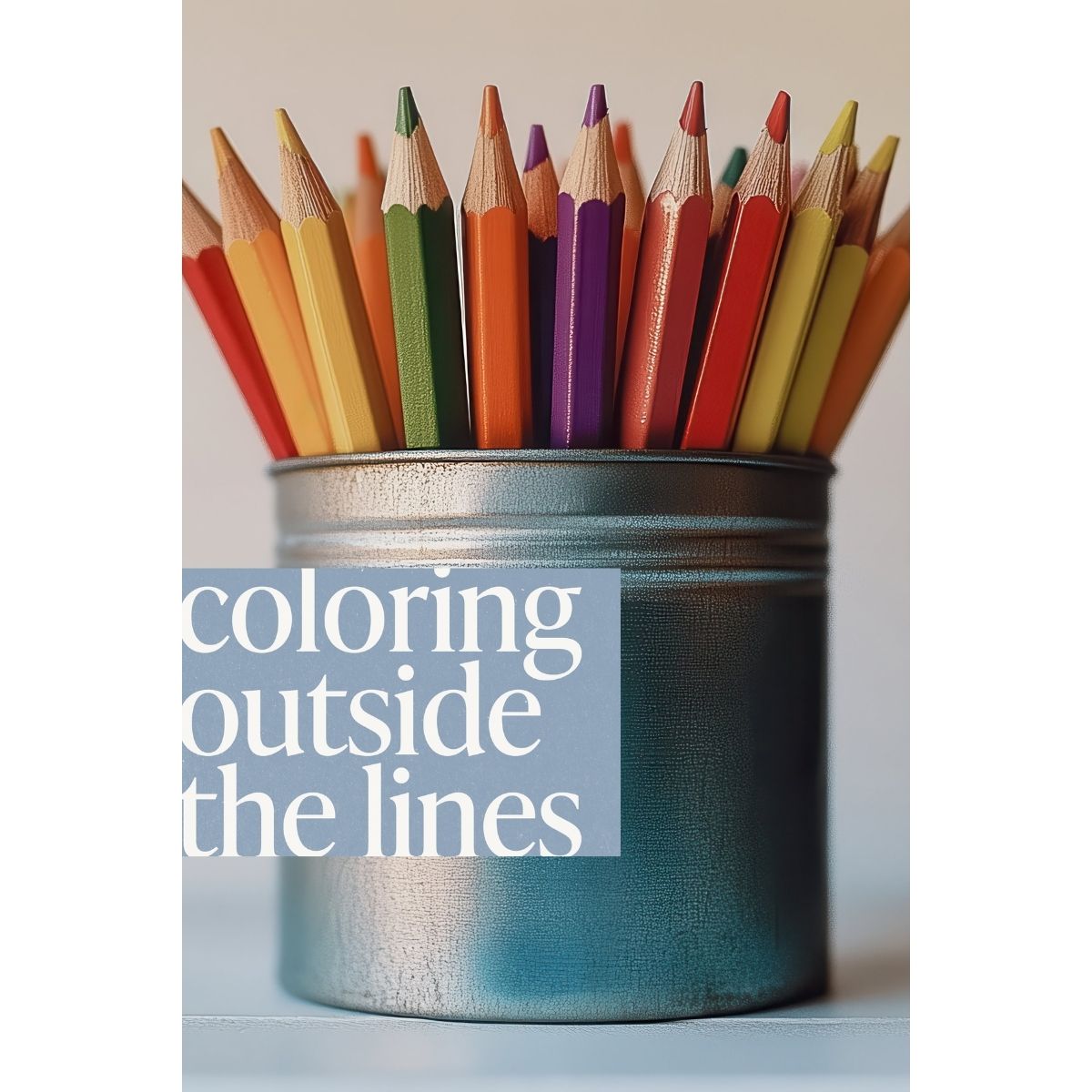 Close-up of colorful pencils in a container with the phrase coloring outside the lines, symbolizing creativity, playful hobbies, artistic freedom, and self-expression.